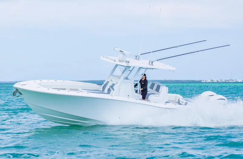 Slide: The Image of 2024 Invincible 33 Open Fisherman boat cruising on the ocean. - 10