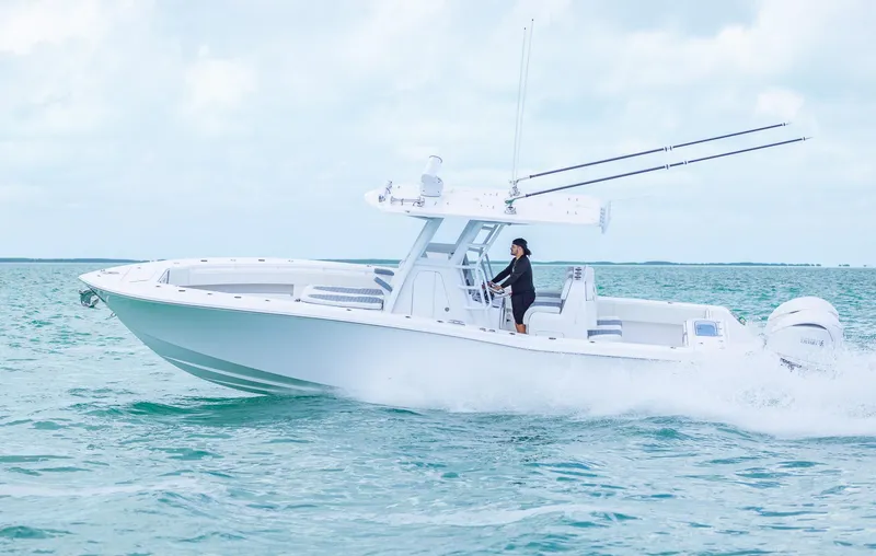 Slide: The Image of 2024 Invincible 33 Open Fisherman boat cruising on the ocean. - 11