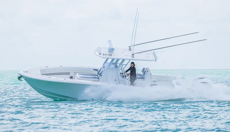 Slide: The Image of 2024 Invincible 33 Open Fisherman boat cruising on the ocean. - 12