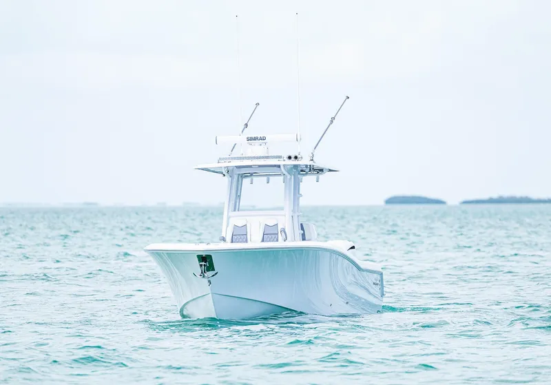 Slide: The Image of 2024 Invincible 33 Open Fisherman boat on calm ocean waters. - 25