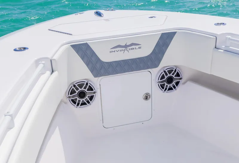 Slide: The Image of 2024 Invincible 33 Open Fisherman boat interior with speakers and storage. - 28