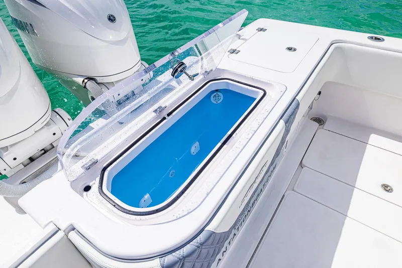 Slide: The Image of 2024 Invincible 33 Open Fisherman livewell and outboard motors. - 37