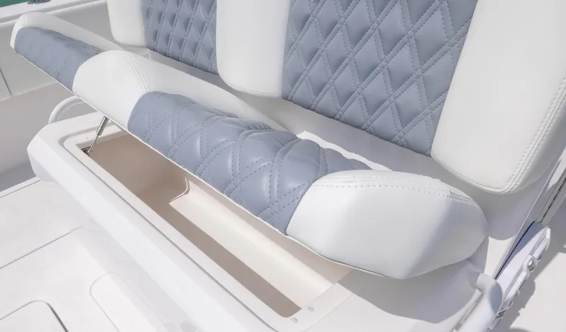 Slide: The Image of 2024 Invincible 33 Open Fisherman boat with cushioned seating and storage compartment. - 38