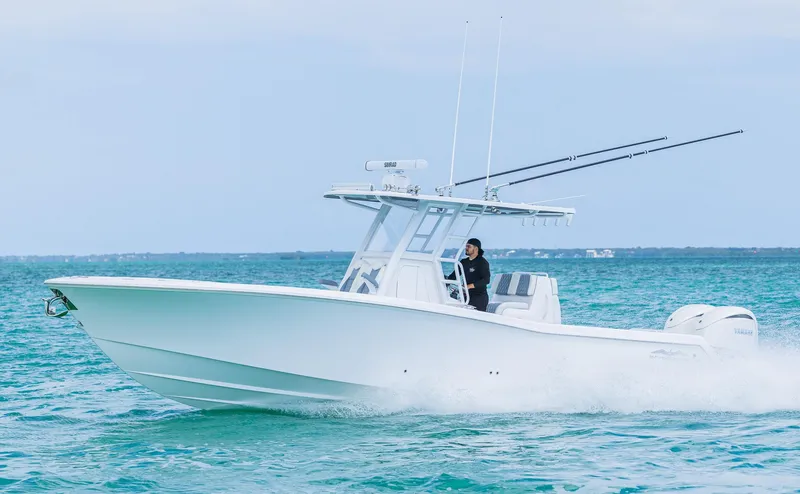 Slide: The Image of 2024 Invincible 33 Open Fisherman boat cruising on the ocean. - 7