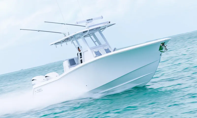 Slide: The Image of 2024 Invincible 33 Open Fisherman boat cruising on the ocean. - 9