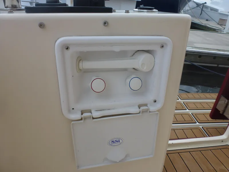 Slide: The Image of Outdoor shower controls on a 2005 Mainship 34 Trawler boat. - 16