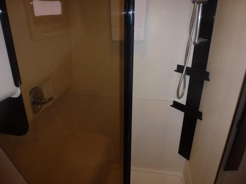 Slide: The Image of 2005 Mainship 34 Trawler bathroom with shower and glass door. - 23