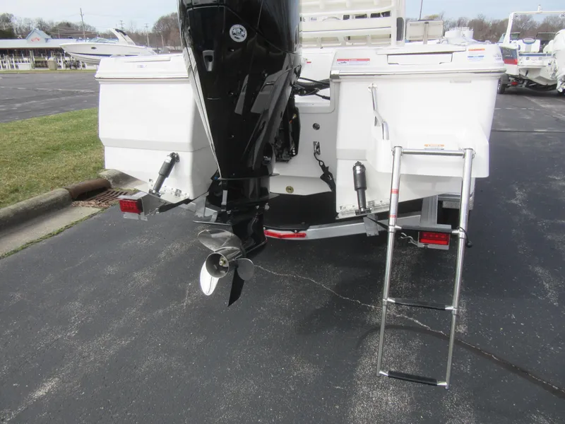 Slide: The Image of 2024 Robalo 226 Cayman boat stern with outboard motor and swim ladder. - 6