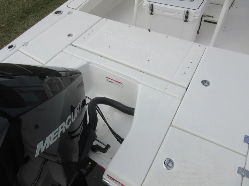 Slide: The Image of 2024 Robalo 226 Cayman boat with Mercury engine, rear deck view. - 7