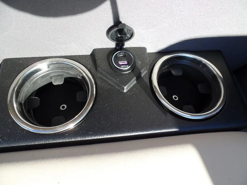 Slide: The Image of 2024 Harris Cruiser 250 cup holders with USB charging port. - 7