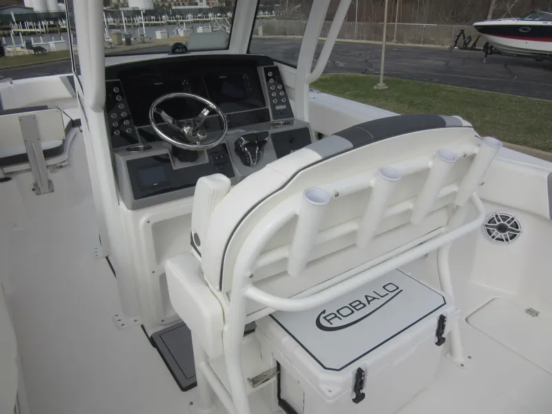 Slide: The Image of 2024 Robalo R250 Center Console boat interior with helm station and seating. - 12