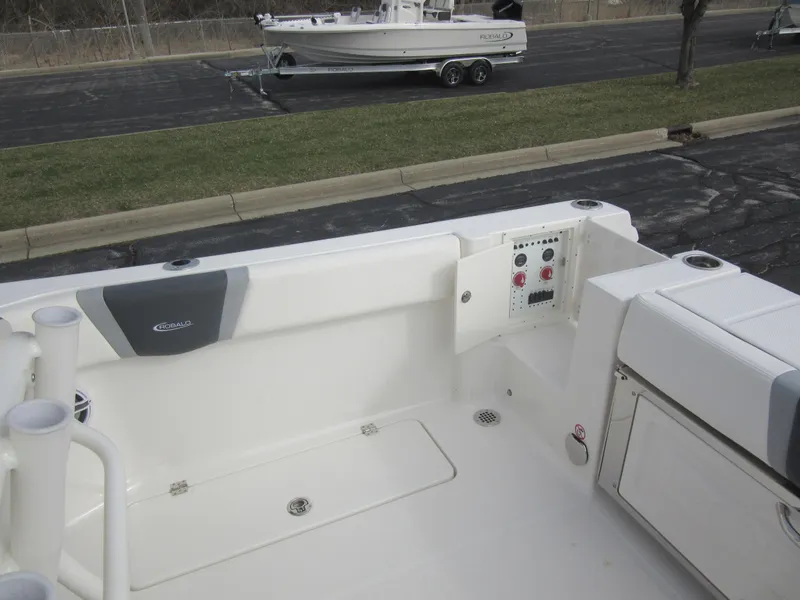 Slide: The Image of 2024 Robalo R250 Center Console boat interior, featuring a clean deck and control panel. - 15