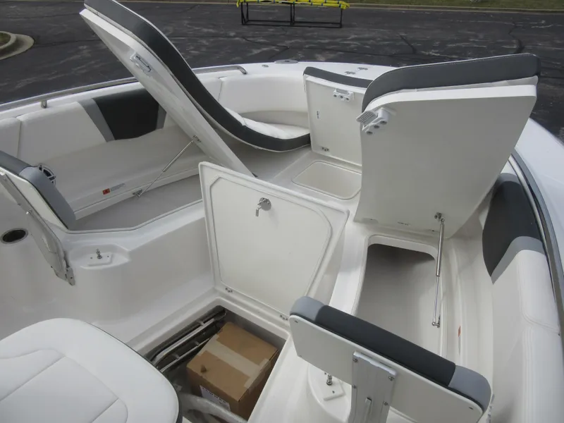Slide: The Image of 2024 Robalo R250 Center Console boat with open storage compartments. - 17