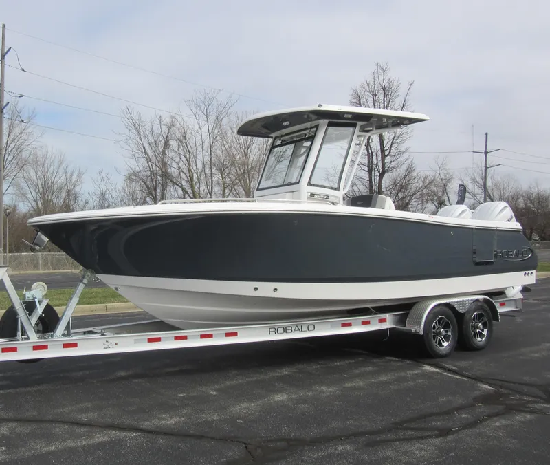 Slide: The Image of 2024 Robalo R250 Center Console boat on trailer, side view. - 3