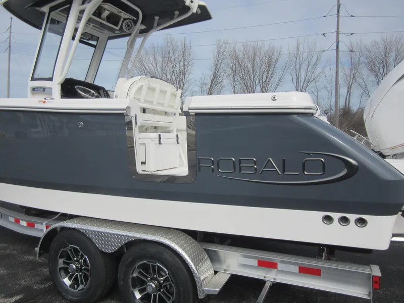 Slide: The Image of 2024 Robalo R250 Center Console boat on trailer, side view. - 6
