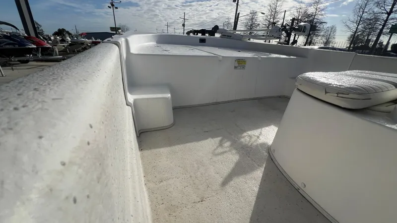 Slide: The Image of 2013 Carolina Skiff 198DLX boat interior with seating and storage compartments. - 10