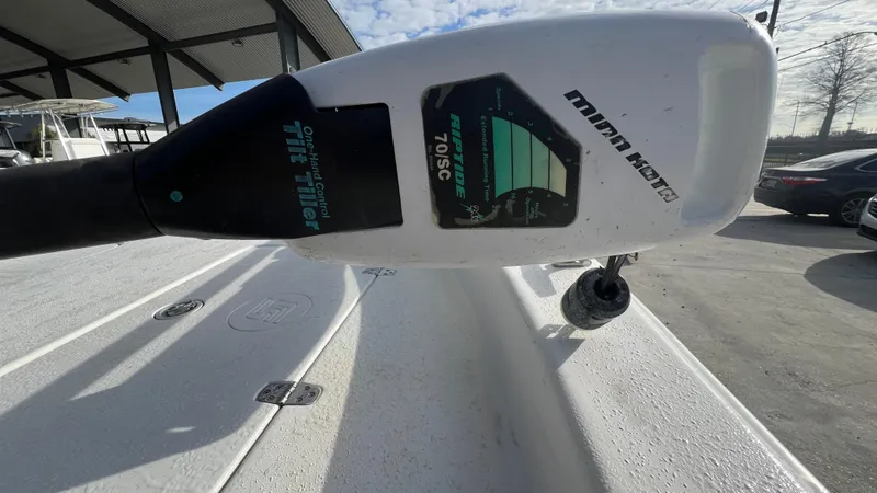 Slide: The Image of Close-up of a 2013 Carolina Skiff 198DLX boat with a Minn Kota trolling motor. - 12