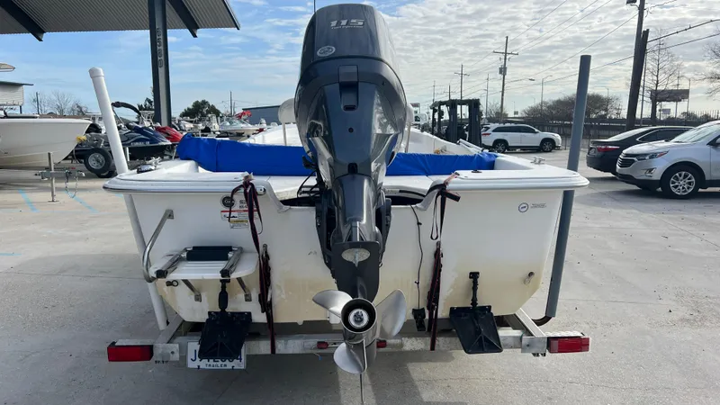 Slide: The Image of 2013 Carolina Skiff 198DLX boat with outboard motor on trailer. - 3