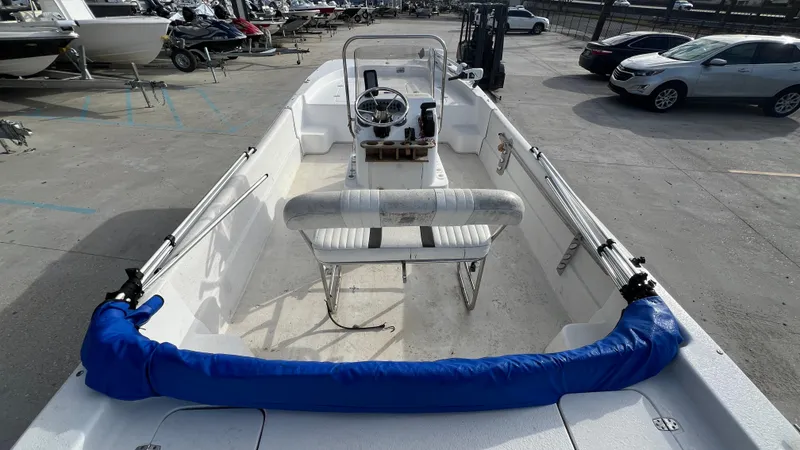Slide: The Image of 2013 Carolina Skiff 198DLX boat interior with steering console and seating. - 8
