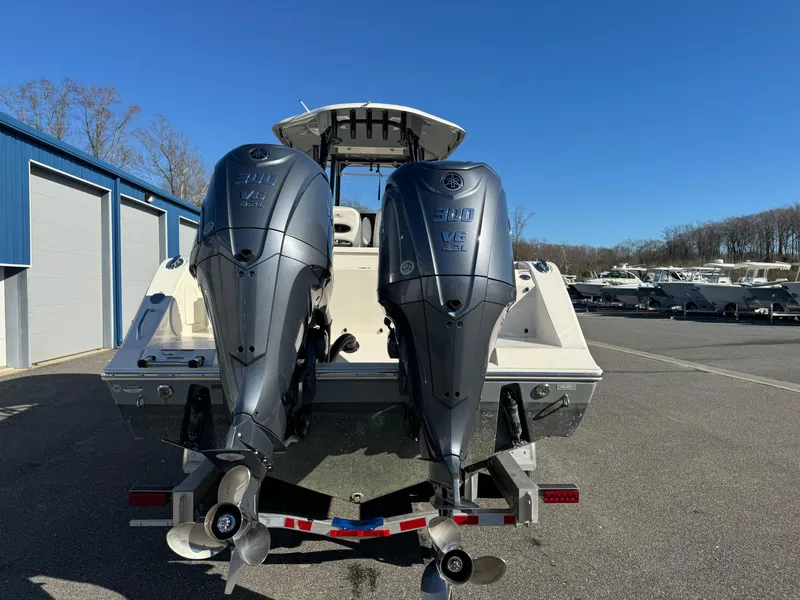Slide: The Image of 2021 Cobia 301 CC boat with dual Yamaha 300 V6 outboard engines. - 7