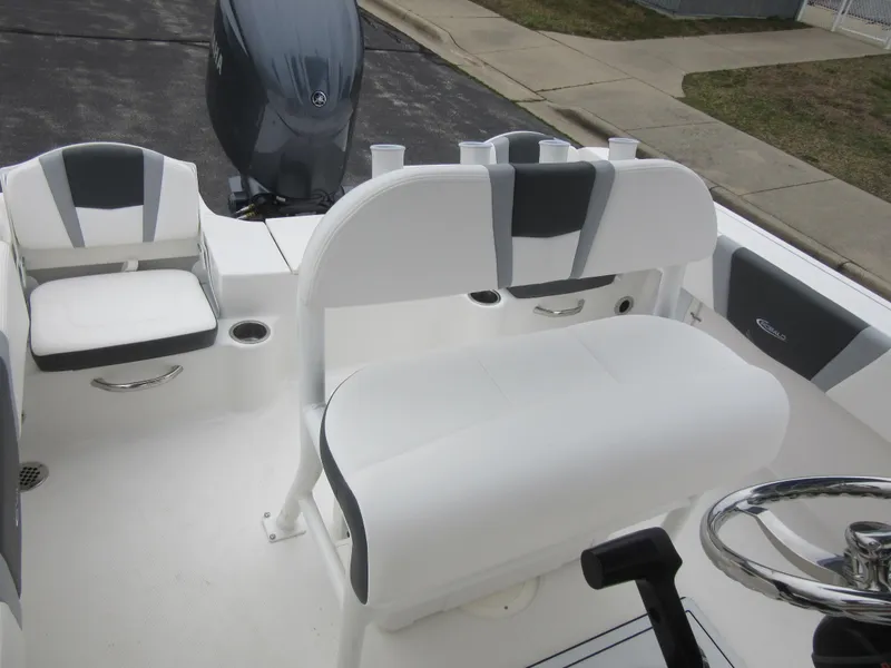 Slide: The Image of 2024 Robalo R180 Center Console boat interior with seating and console. - 11