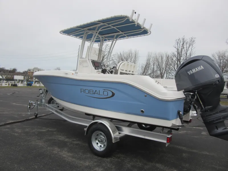 Slide: The Image of 2024 Robalo R180 Center Console boat on trailer with Yamaha outboard motor. - 5