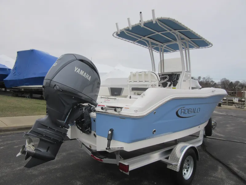 Slide: The Image of 2024 Robalo R180 Center Console boat with Yamaha outboard motor on trailer. - 6