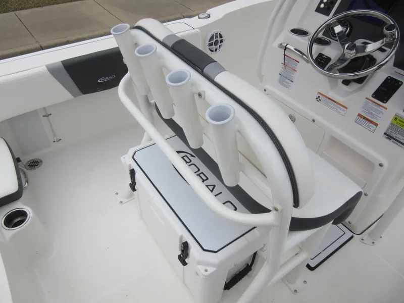 Slide: The Image of 2024 Robalo R180 Center Console boat interior with rod holders and cooler. - 7