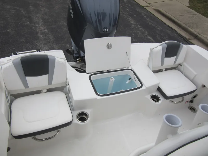 Slide: The Image of 2024 Robalo R180 Center Console boat with seating and storage compartments. - 9