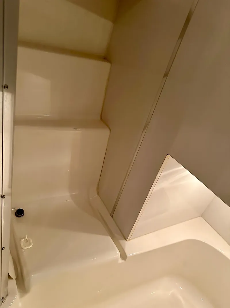 Slide: The Image of 1997 Bayliner 3988 Motoryacht interior stairs, white and sleek design. - 22