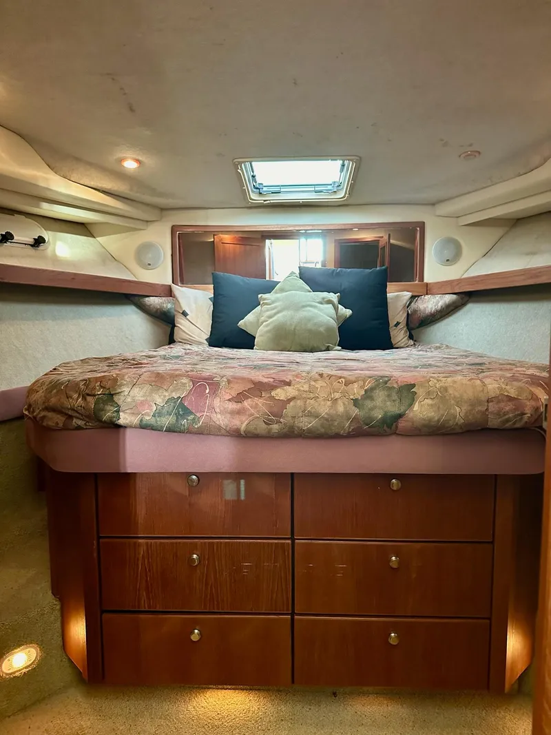 Slide: The Image of Cozy bedroom in 1997 Bayliner 3988 Motoryacht with skylight and wooden cabinetry. - 30
