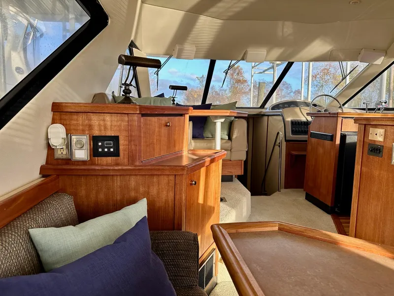 Slide: The Image of Interior of 1997 Bayliner 3988 Motoryacht with wood accents and comfortable seating. - 41
