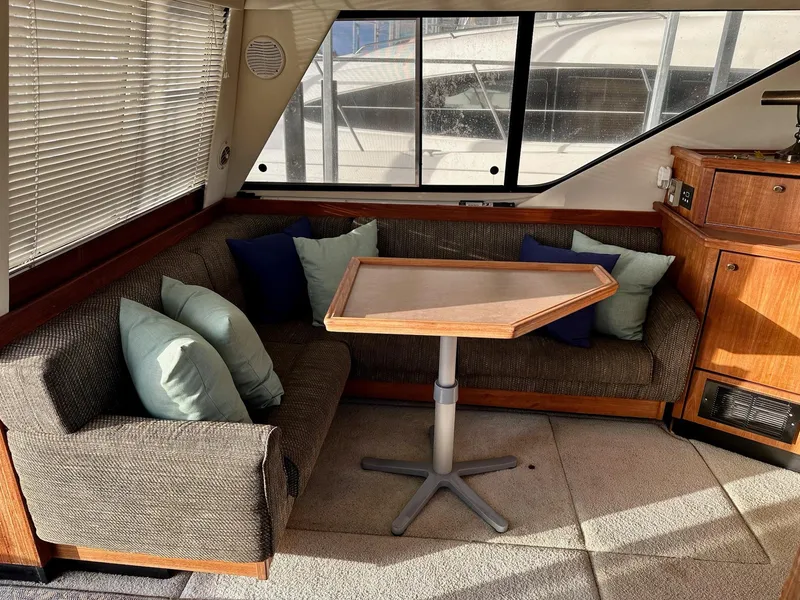Slide: The Image of Interior of 1997 Bayliner 3988 Motoryacht with cozy seating and table. - 44
