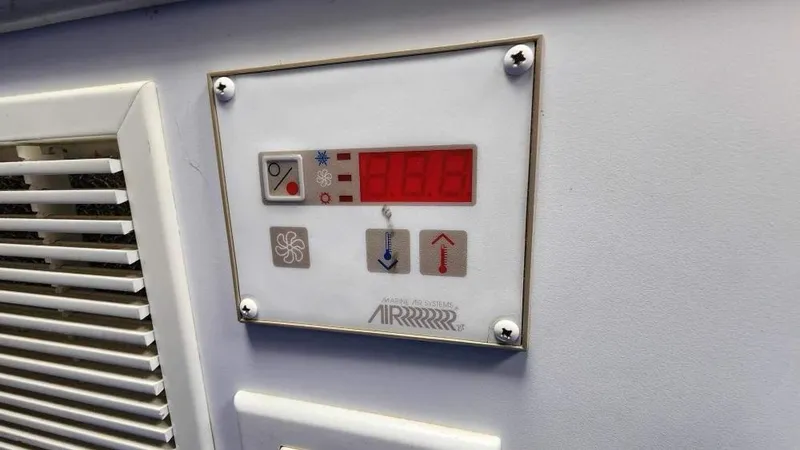 Slide: The Image of Control panel of a 1996 Formula 382 SR1 boat's air conditioning system. - 11