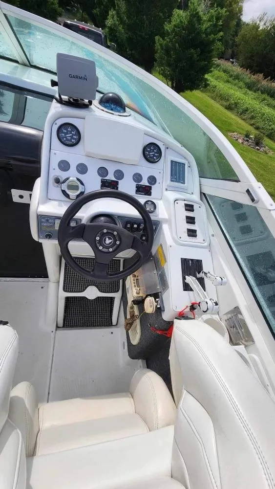 Slide: The Image of 1996 Formula 382 SR1 boat cockpit with steering wheel and control panel. - 13