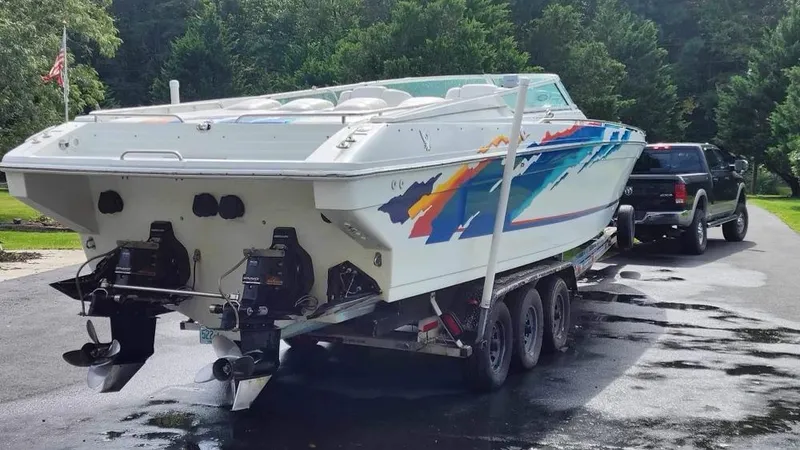 Slide: The Image of 1996 Formula 382 SR1 speedboat on a trailer, towed by a black truck. - 15