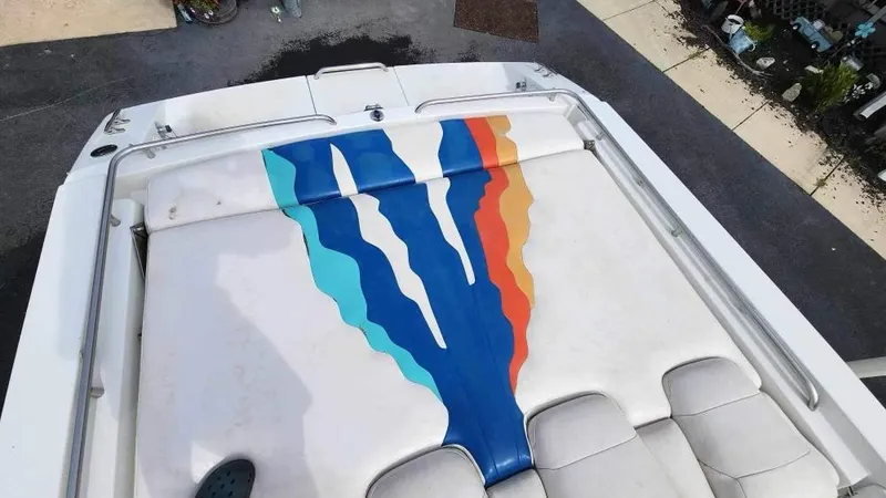 Slide: The Image of 1996 Formula 382 SR1 boat with colorful seat upholstery design. - 2