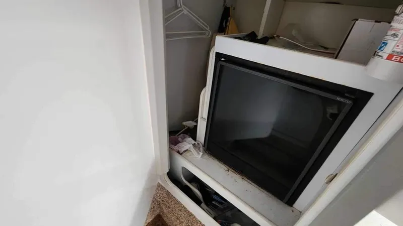 Slide: The Image of Small refrigerator inside a 1996 Formula 382 SR1 boat cabin. - 7