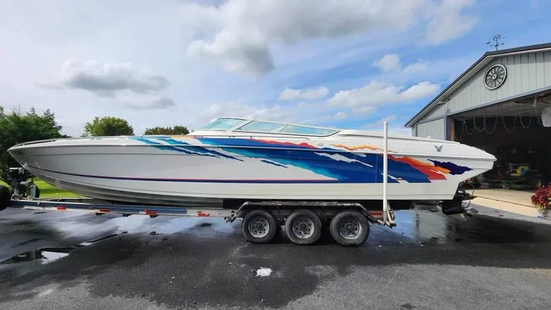 Slide: The Image of 1996 Formula 382 SR1 speedboat with colorful graphics on a trailer. - 8