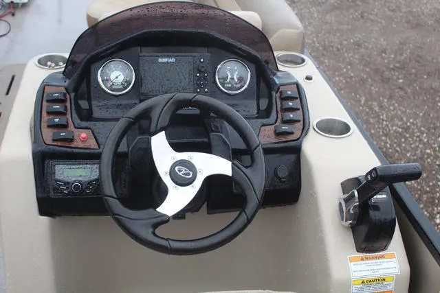Slide: The Image of 2022 Veranda VF25F2 boat dashboard with steering wheel and controls. - 10