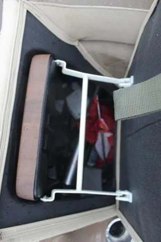 Slide: The Image of Interior view of a 2022 Veranda VF25F2 storage compartment with various items inside. - 12