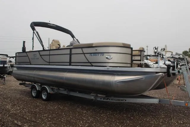 Slide: The Image of 2022 Veranda VF25F2 pontoon boat on trailer in outdoor setting. - 3