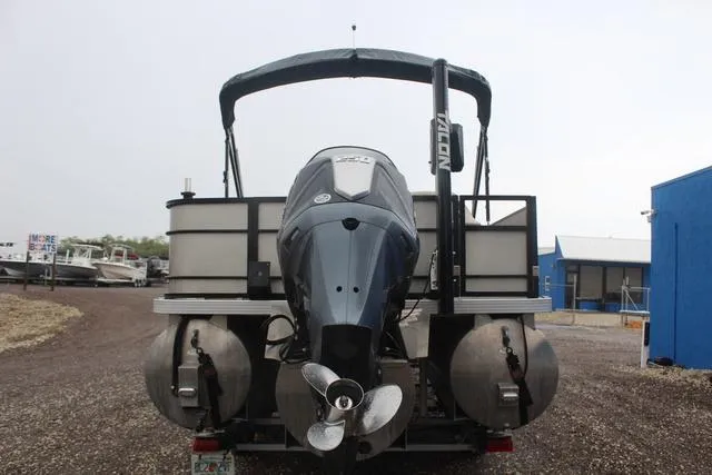 Slide: The Image of 2022 Veranda VF25F2 pontoon boat rear view with motor and canopy. - 5