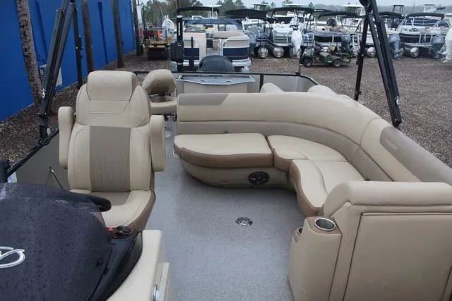 Slide: The Image of 2022 Veranda VF25F2 pontoon boat with beige seating and spacious deck layout. - 8