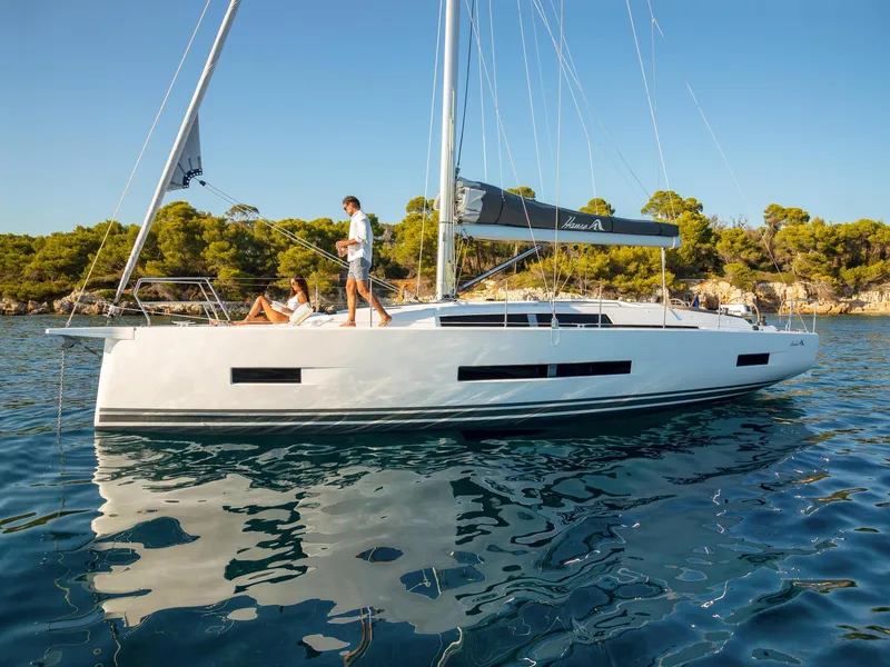 Slide: The Image of 2024 Hanse 410 sailboat on calm water with people on deck. - 10
