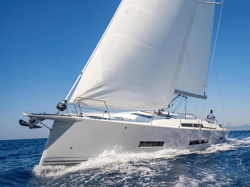 Slide: The Image of 2024 Hanse 410 sailing yacht cruising on open water. - 27