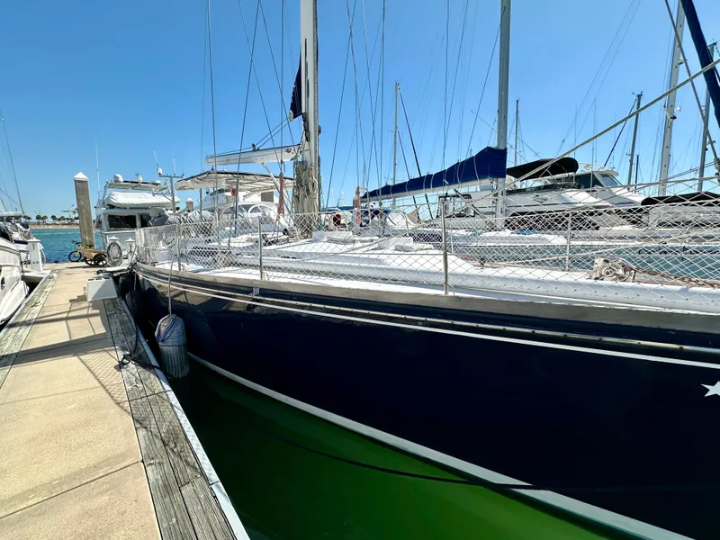 Slide: The Image of 1989 Concordia 52 sailboat docked at marina on a sunny day. - 10
