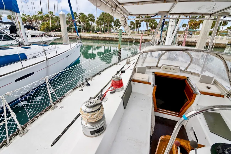 Slide: The Image of Cockpit view of a 1989 Concordia 52 sailboat docked at a marina. - 12