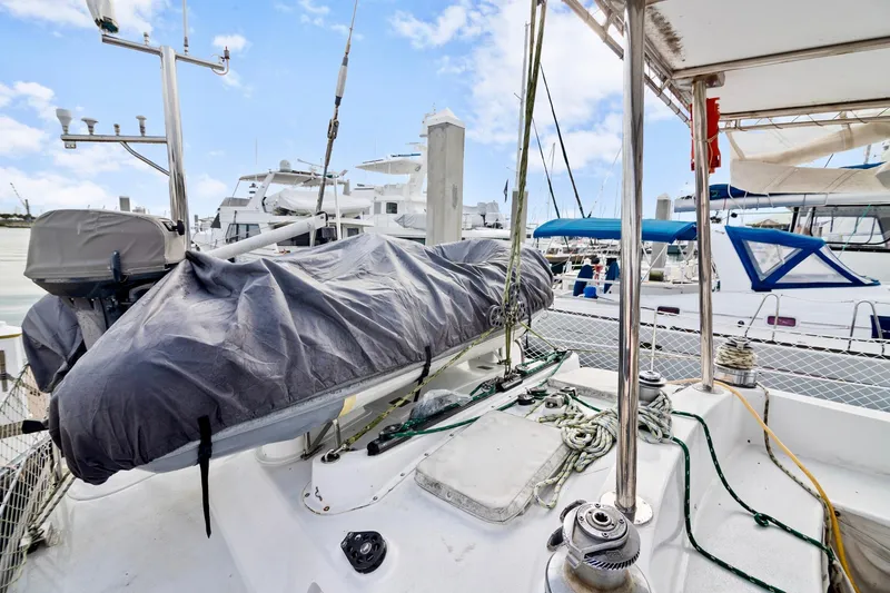 Slide: The Image of Concordia 52 sailboat deck with covered equipment, docked at marina, 1989 model. - 14