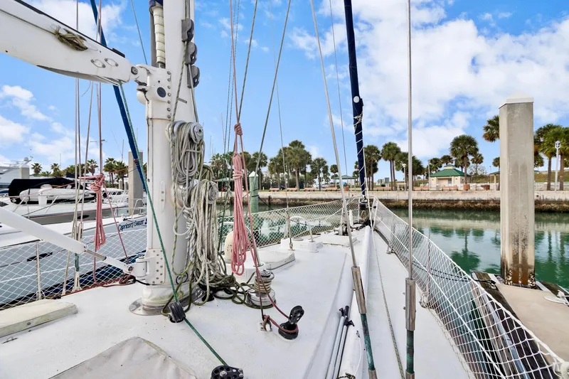 Slide: The Image of 1989 Concordia 52 sailboat docked at a marina with clear skies. - 15